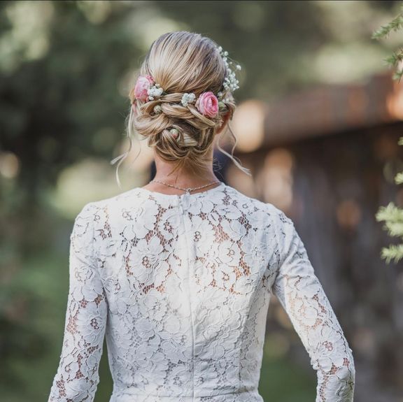 The hairstyle of a woman in a wedding dress from the back