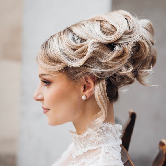 The hairstyle of a woman in a wedding dress from the side